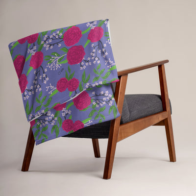 Phi Mu Carnation Floral Print Throw Blanket, Purple shown on chair