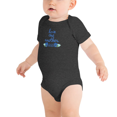 Tri Delta Love One Another Baby Onesie in dark gray shown on toddler model