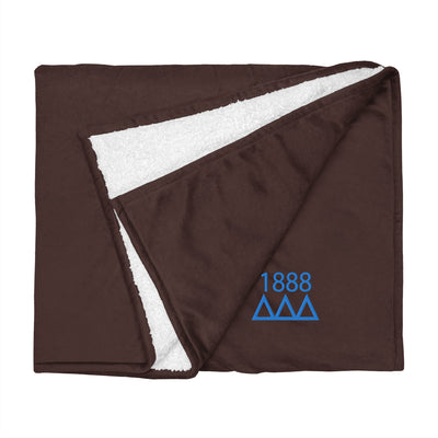 Tri Delta Plush Embroidered Sherpa Blanket in brown shown flat