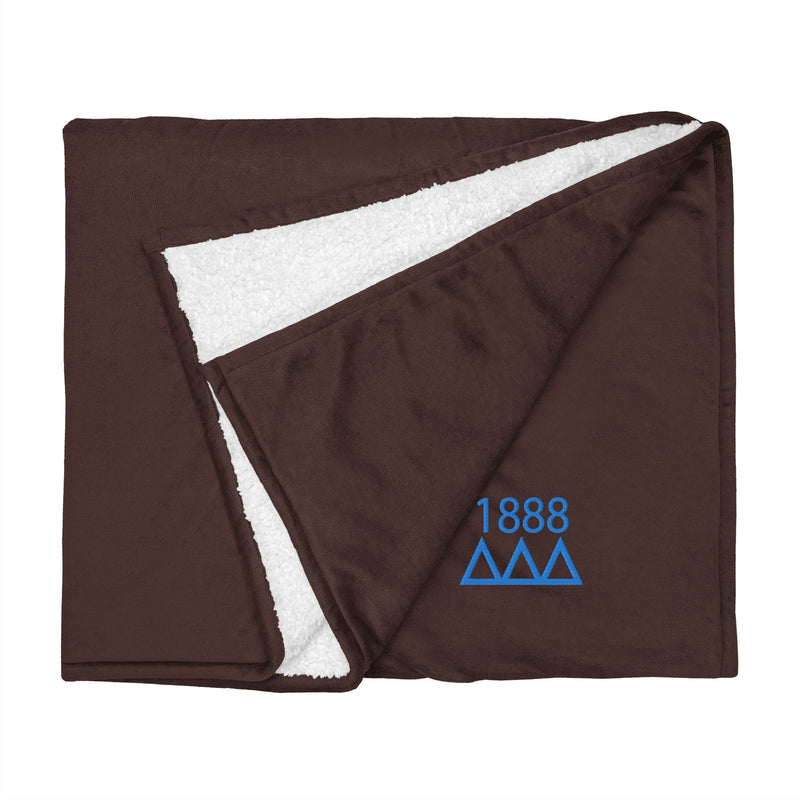 Tri Delta Plush Embroidered Sherpa Blanket in brown shown flat