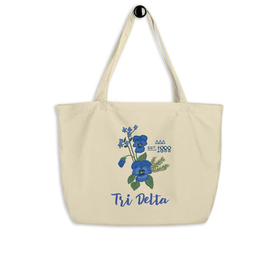 Tri Delta Large Sorority Tote Bag in natural oyster shown hanging on a hook