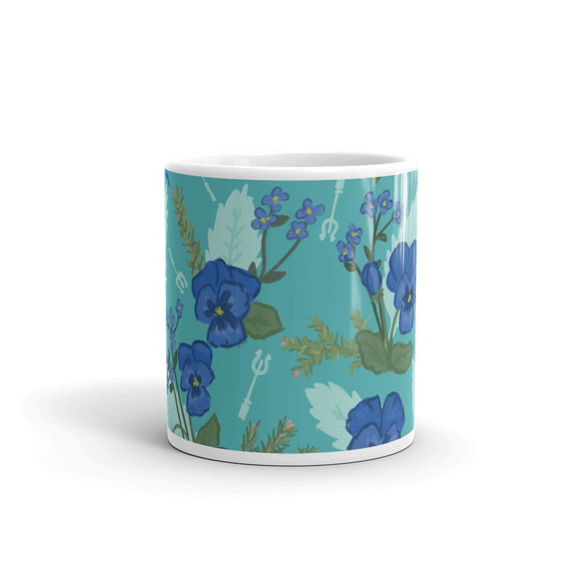 Tri Delta Sorority Mug showing pansy floral print in teal that wraps around 11 oz mu