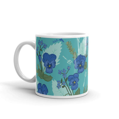 Tri Delta Sorority Mug with pansy floral print in teal in 11 oz size with handle on left