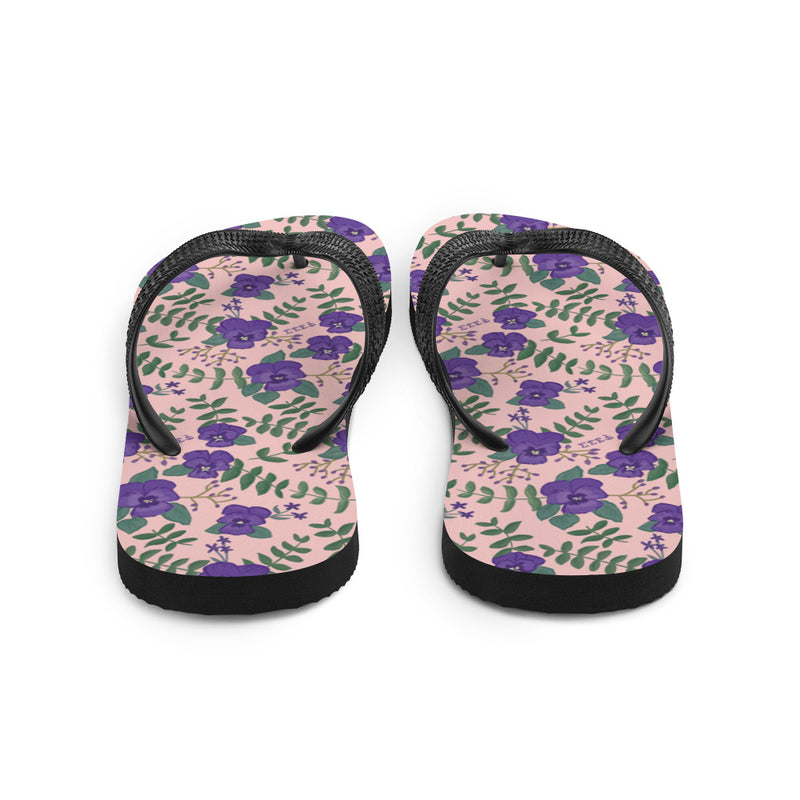 Tri Sigma flip flops in violet floral print shown in back view