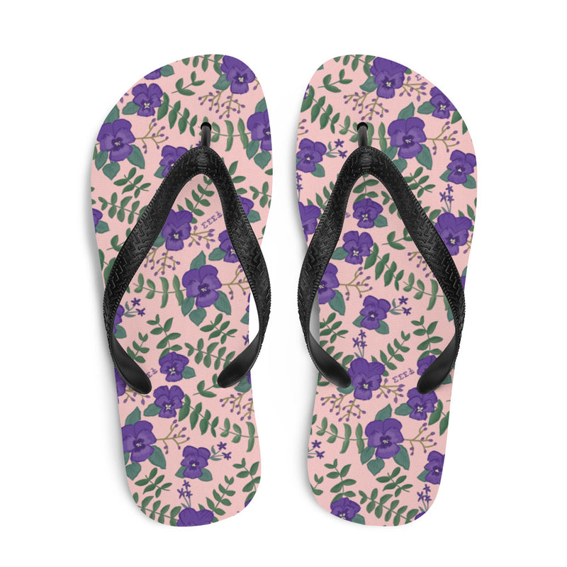 Top view of Tri Sigma flip flops in pink with violet floral print