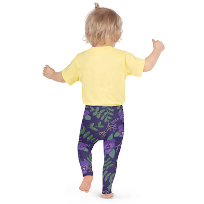 Tri Sigma Violet Floral Print Kid's Leggings in purple shown in back view on toddler 