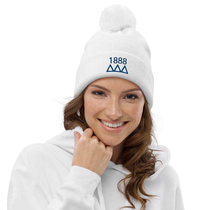 Tri Delta Sorority Pom Pom Beanie in white with blue emmbroidery