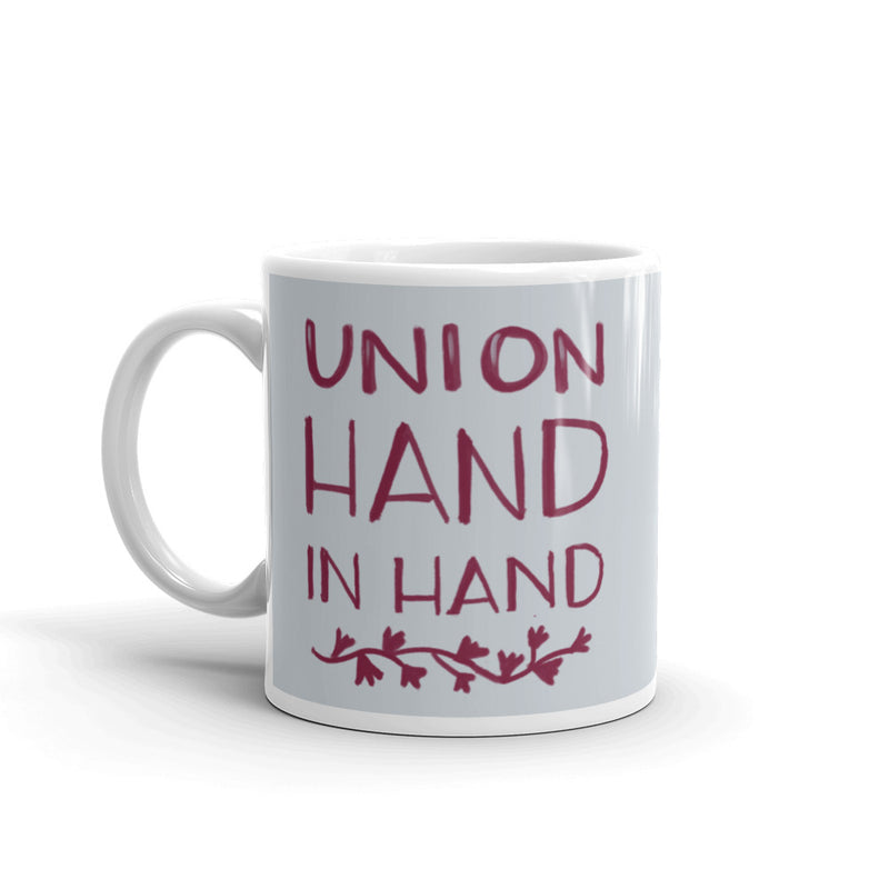 Close up view of front of Alpha Phi Union Hand in Hand motto mug.